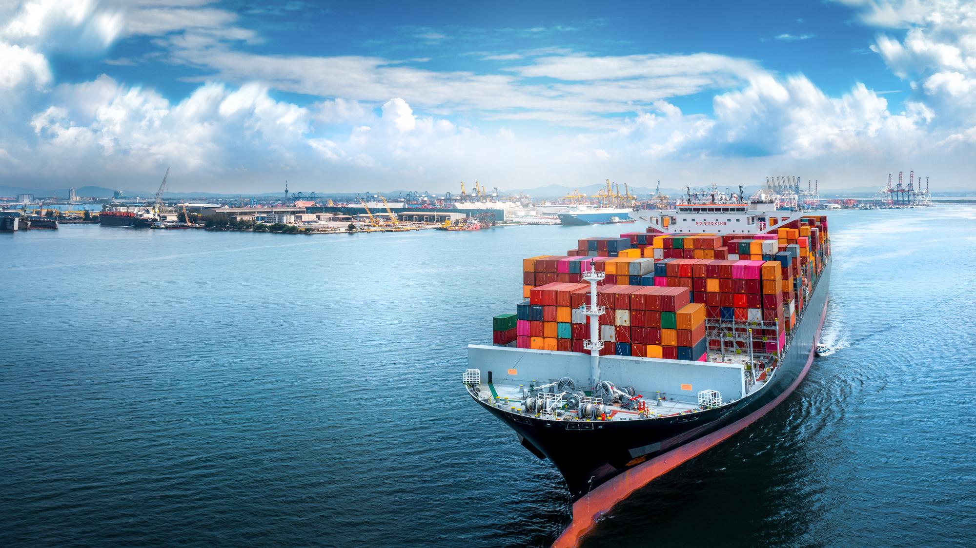 aerial-side-view-cargo-ship-carrying-container-running-export-goods-from-cargo-yard-port-custom-ocean-concept-technology-transportation-customs-clearance_33850-593